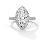 Diamond ring with a marquise-shaped center stone on a white background 