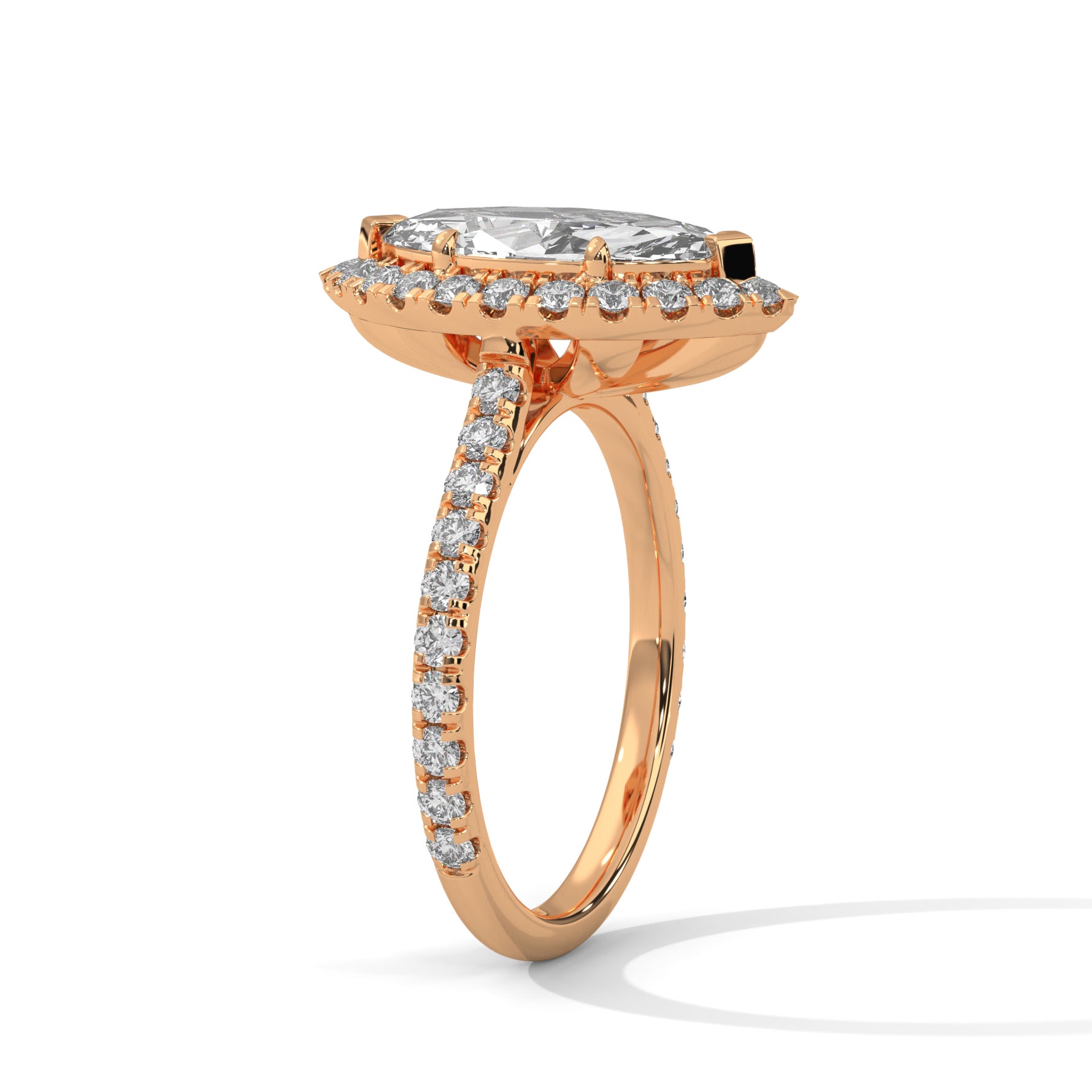 Rose gold ring with a large diamond and smaller diamonds on a white background 