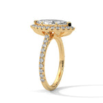 Gold ring with a large central diamond and smaller diamonds around on a white background 