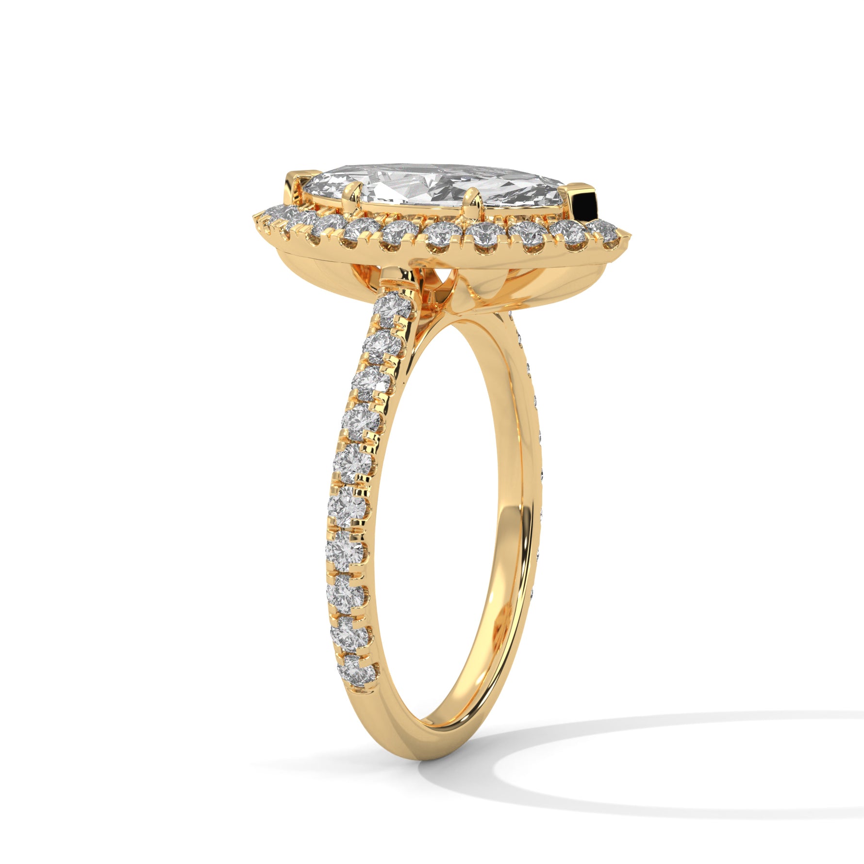 Gold ring with a large central diamond and smaller diamonds around on a white background 