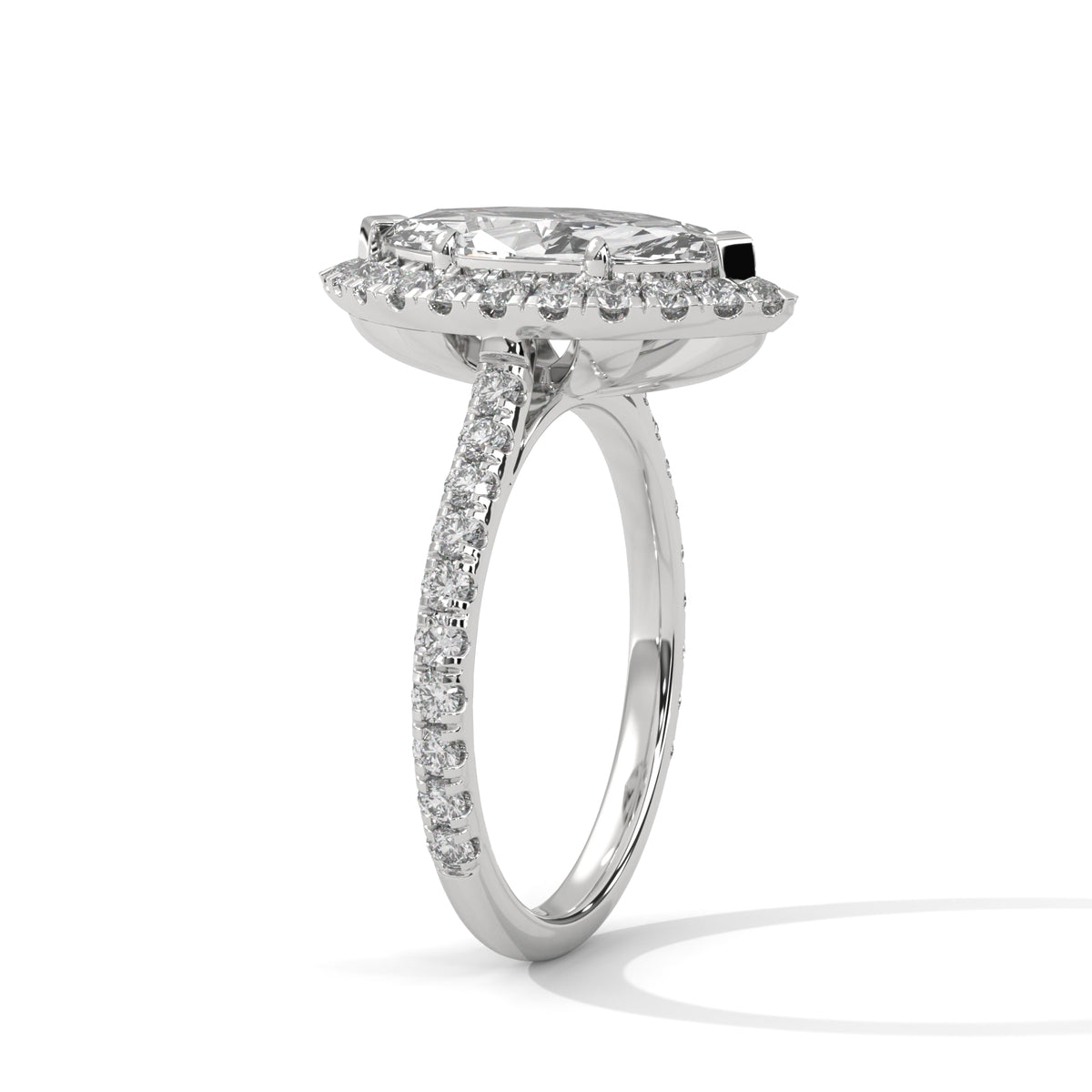 Diamond ring with a marquise-shaped center stone on a white background 