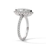 Diamond ring with a marquise-shaped center stone on a white background 