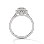 Diamond ring with a marquise-shaped center stone on a white background 