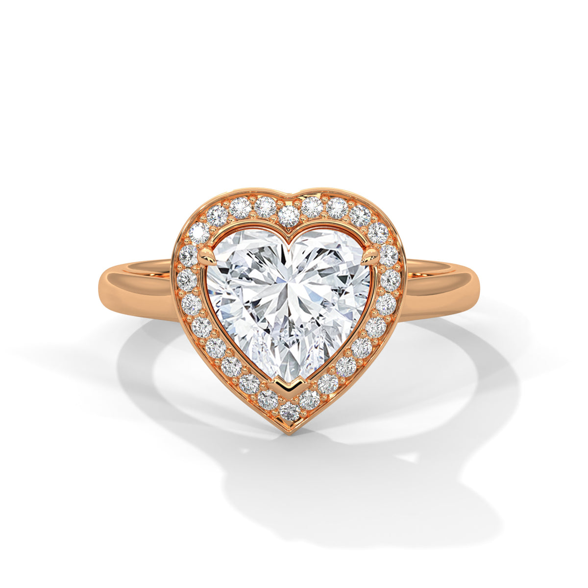 Heart-shaped diamond ring with rose gold band on a white background 