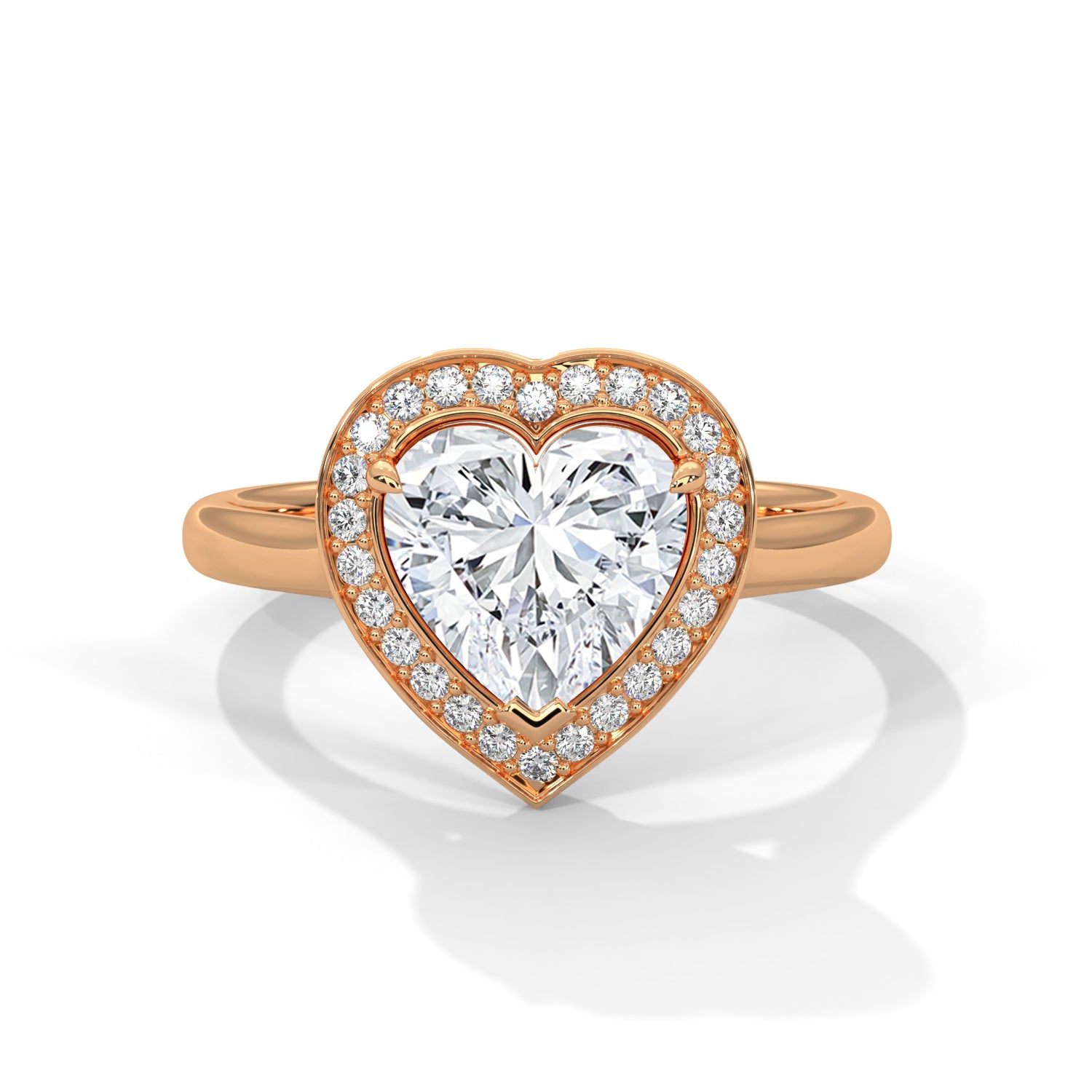 Heart-shaped diamond ring with rose gold band on a white background 