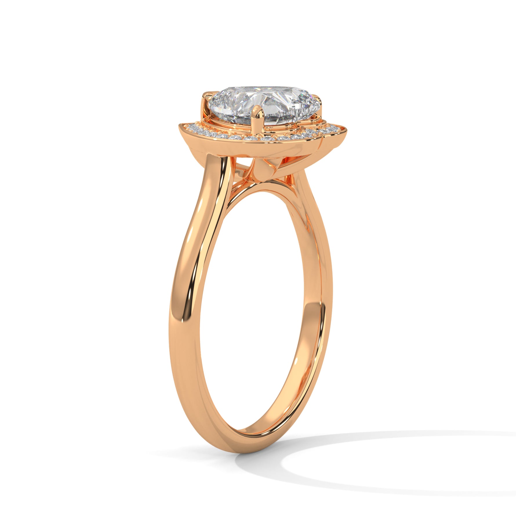 Heart-shaped diamond ring with rose gold band on a white background 