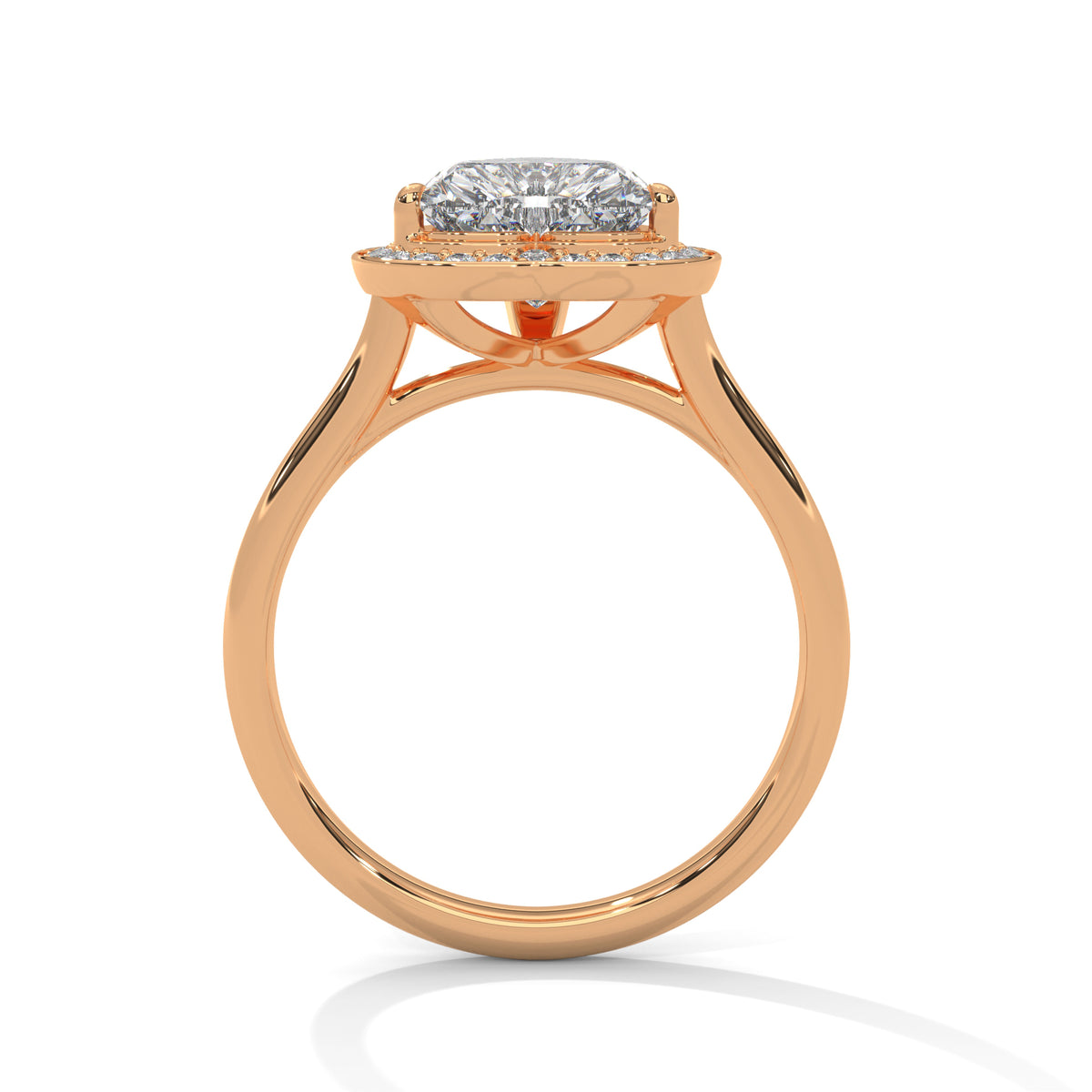 Heart-shaped diamond ring with rose gold band on a white background 