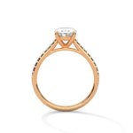 Rose gold ring with a large diamond on a white background 