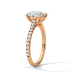 Rose gold ring with a large diamond on a white background 
