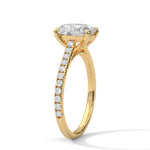 Gold ring with a large diamond on a white background 