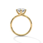 Gold ring with a large diamond on a white background 