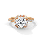 Rose gold ring with a large diamond on a white background 