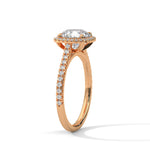 Rose gold ring with a large diamond on a white background 