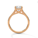 Rose gold ring with a large diamond on a white background 