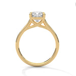 Gold ring with a large diamond on a white background 