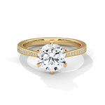 Gold ring with a large diamond on a white background 