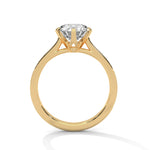 Gold ring with a large diamond on a white background 