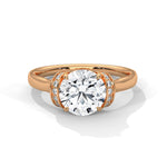 Rose gold ring with a large diamond on a white background 