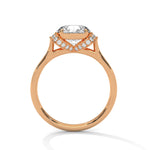 Rose gold ring with a large diamond on a white background 