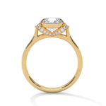 Gold ring with a large diamond on a white background 
