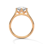 Rose gold ring with a large diamond on a white background 