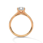 Rose gold ring with a large diamond on a white background 