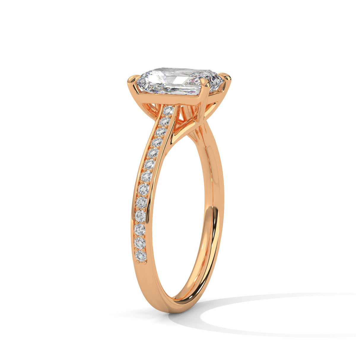 Rose gold ring with a large diamond on a white background 
