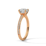 Rose gold ring with a large diamond on a white background 