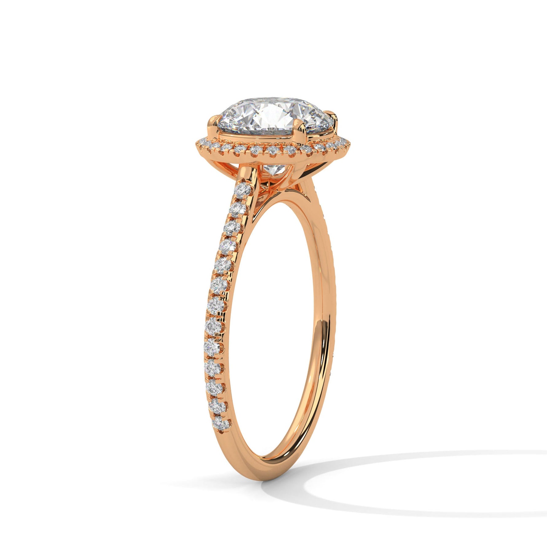 Rose gold ring with a large diamond on a white background 