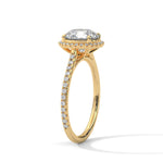 Gold ring with a large diamond on a white background 