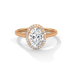 Rose gold ring with a large diamond on a white background 