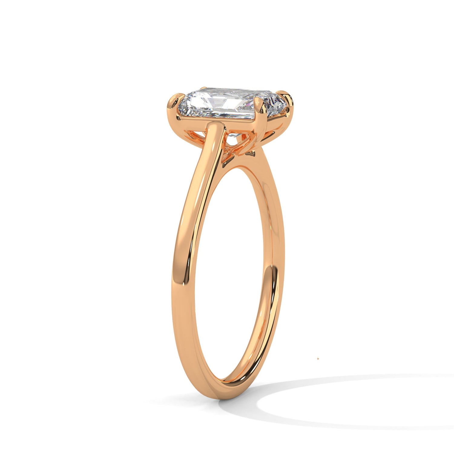 Rose gold ring with a large diamond on a white background 