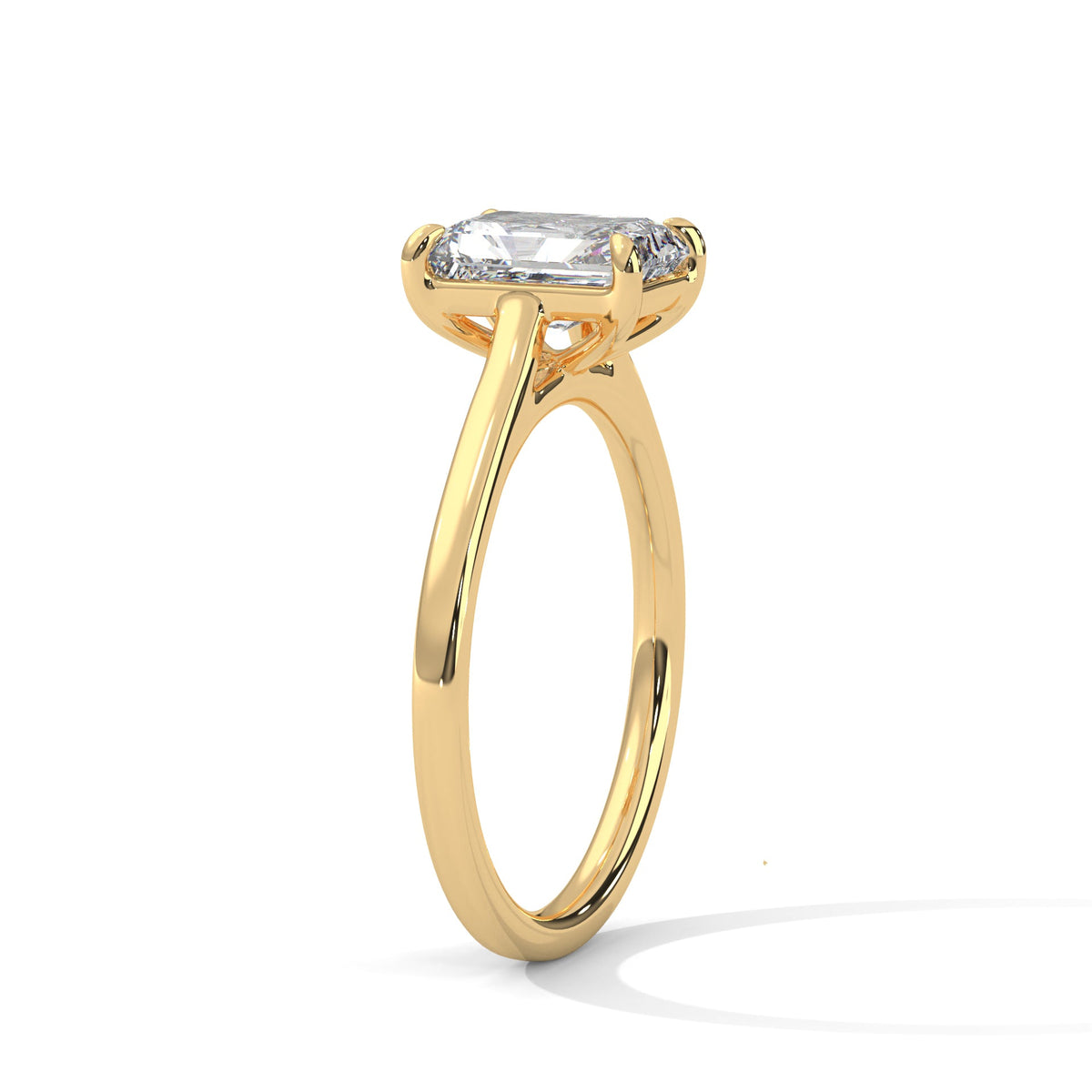 Gold ring with a large diamond on a white background 