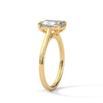 Gold ring with a large diamond on a white background 