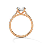 Rose gold ring with a large diamond on a white background 