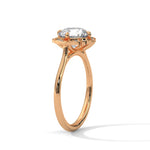 Rose gold ring with a large diamond on a white background 