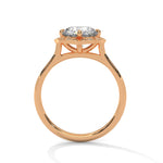 Rose gold ring with a large diamond on a white background 