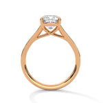 Rose gold ring with a large diamond on a white background 