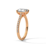 Rose gold ring with a large diamond on a white background 