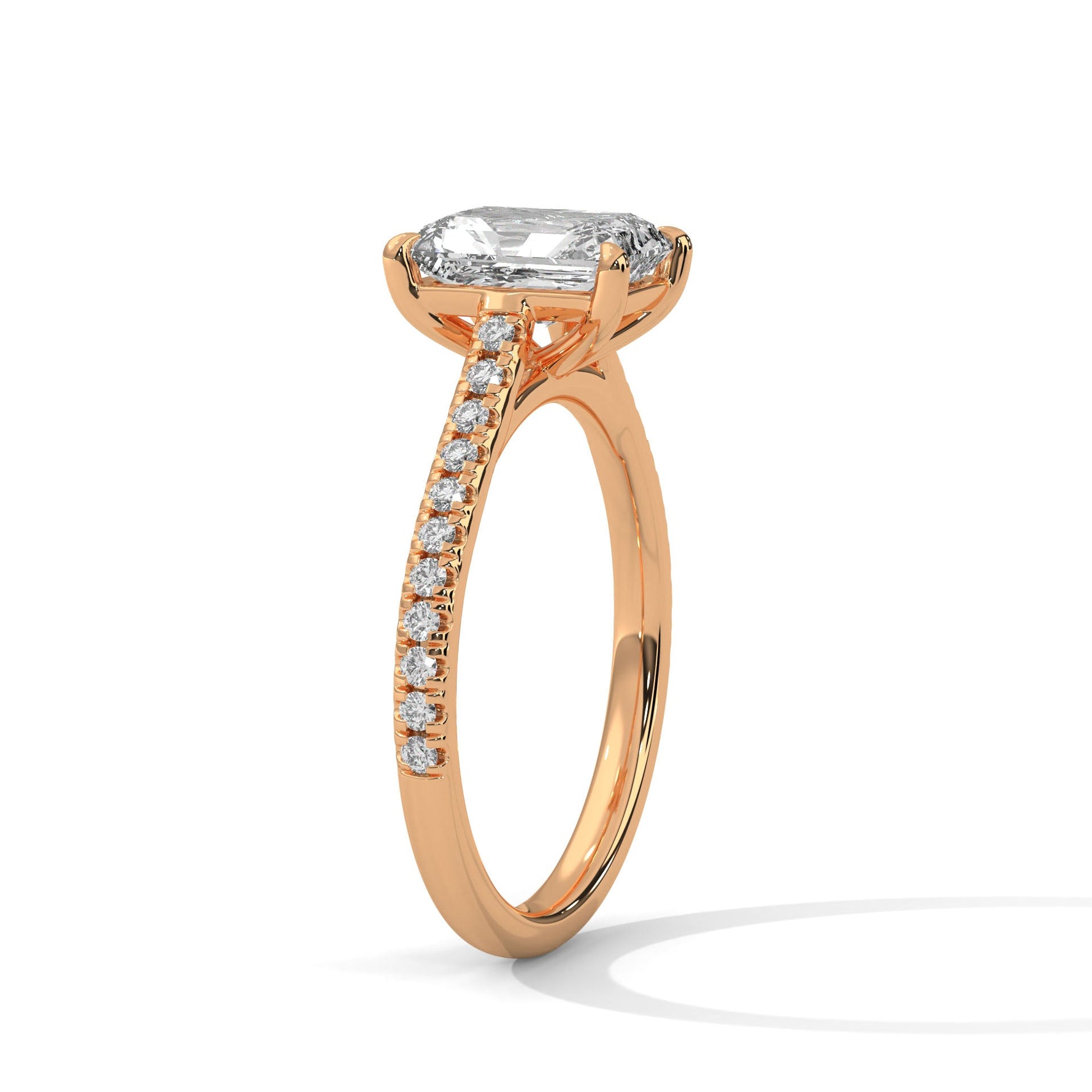 Rose gold ring with a large diamond on a white background 