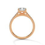 Rose gold ring with a large diamond on a white background 