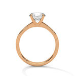Rose gold ring with a large diamond on a white background 