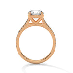 Rose gold ring with a large diamond on a white background 