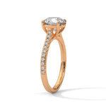 Rose gold ring with a large diamond on a white background 
