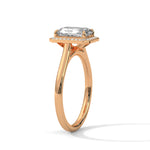 Rose gold ring with a large diamond on a white background 