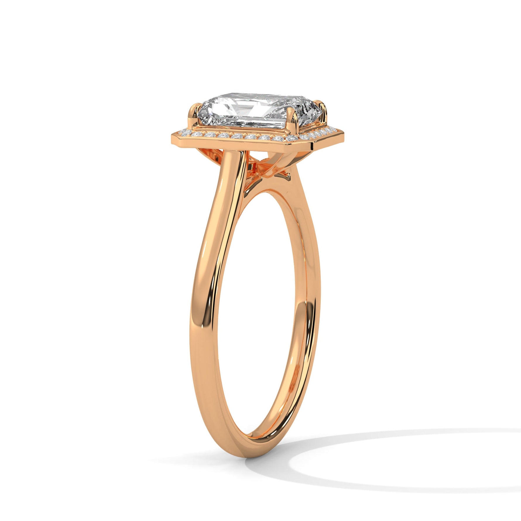 Rose gold ring with a large diamond on a white background 