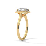 Gold ring with a large diamond on a white background 