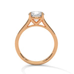 Rose gold ring with a large diamond on a white background 