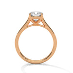 Rose gold ring with a large diamond on a white background 