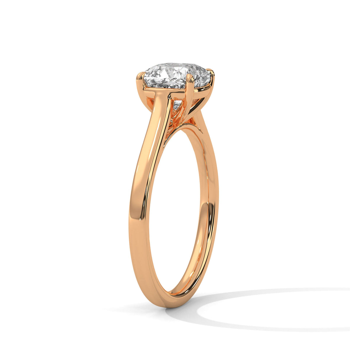 Rose gold ring with a large diamond on a white background 